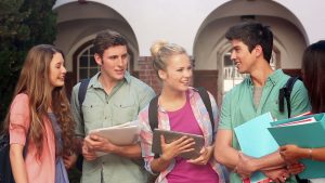 stock-footage-happy-students-chatting-together-outside-on-college-campus